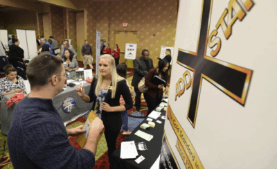 Photo of Add Staff technical recruiter Jen McReady talks with job seeker Nathan Zaborski at a 2017 job fair hosted by the Pikes Peak Workforce Center. The workforce center is hosting its annual job fair for military veterans and the general public on Nov. 5, 2025. (Mark Reis, The Gazette file)