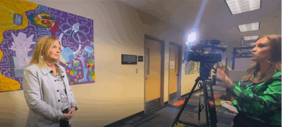 Photo of Pikes Peak Workforce Center Executive Director Traci Marques being interviewed by Meghan Glova from KOAA.